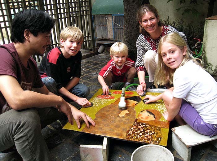 Family meeting with artist in Hanoi, Vietnam to learn lacquer